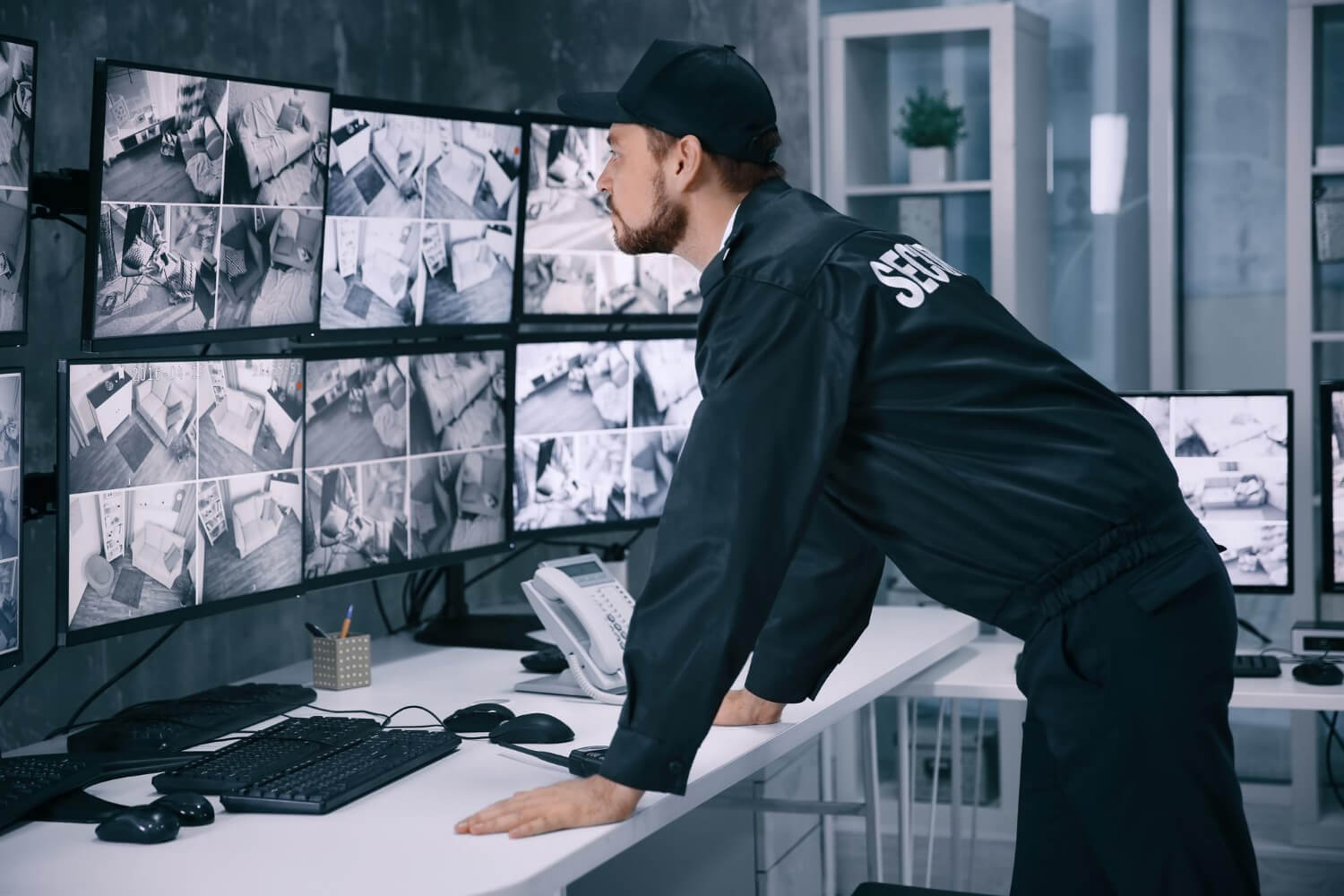 male-security-guard-working-in-surveillance-room